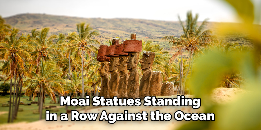 Moai Statues Standing in a Row Against the Ocean
